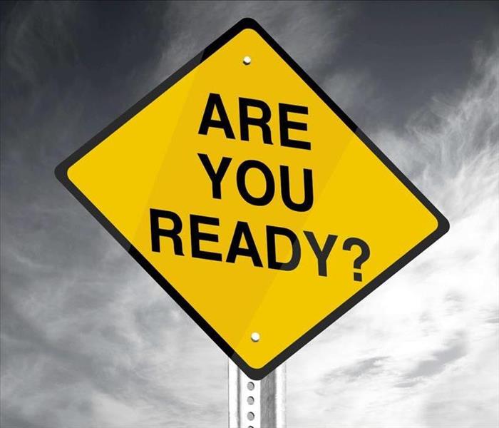 Diamon shaped yellow sign that says "are you ready"